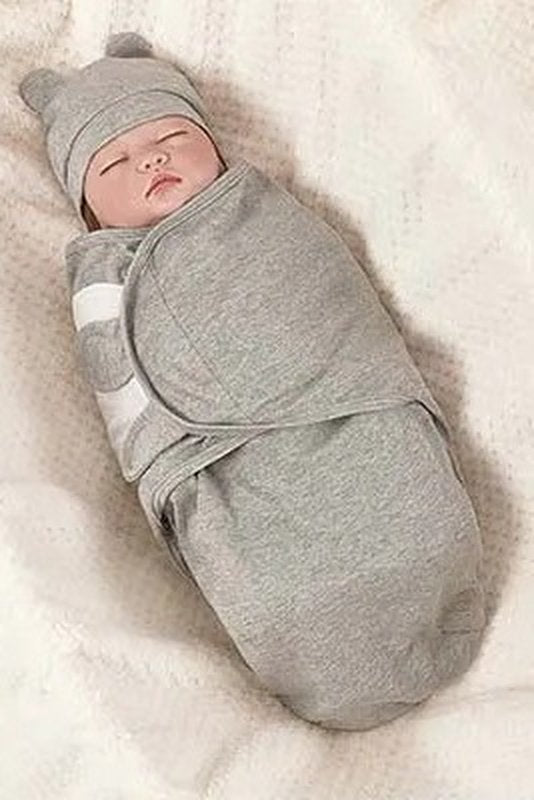 Baby in a grey Swaddle Buddy