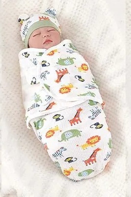 Baby in a safari print Swaddle Buddy