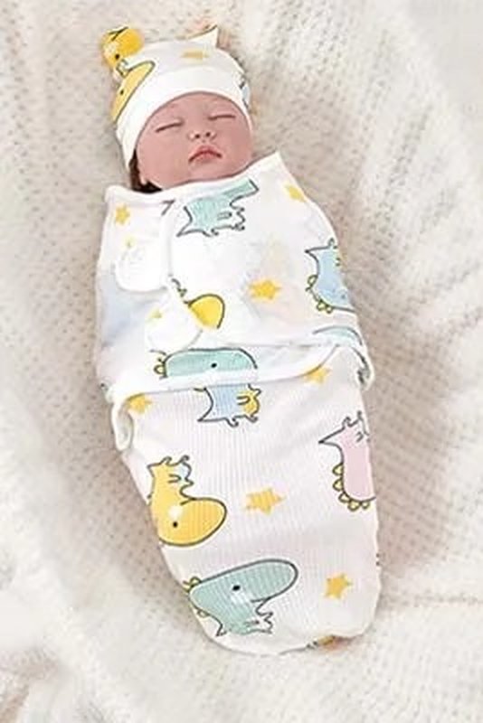 Baby snug in a dino print Swaddle Buddy
