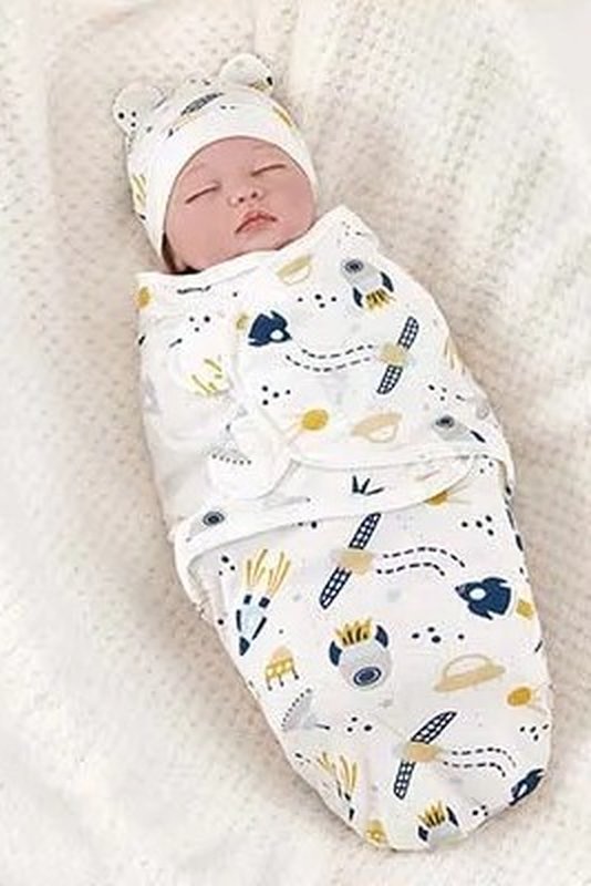 Baby in a printed Swaddle Buddy
